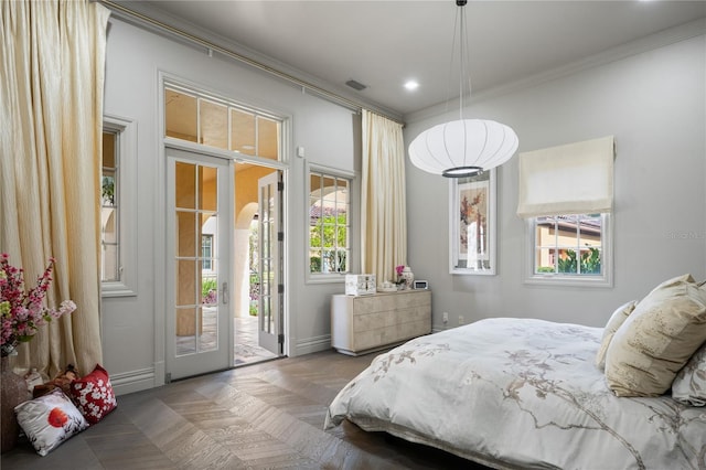 bedroom with access to exterior, french doors, and multiple windows