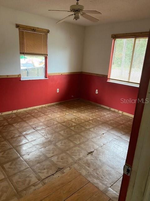 spare room featuring ceiling fan