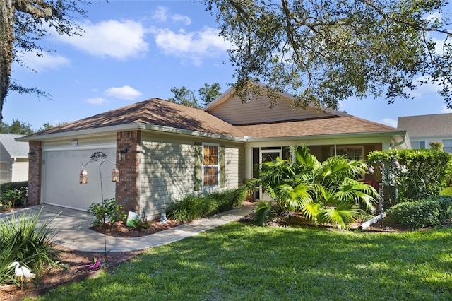 view of front of home with a garage and a front yard