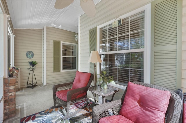 sunroom / solarium featuring ceiling fan and lofted ceiling