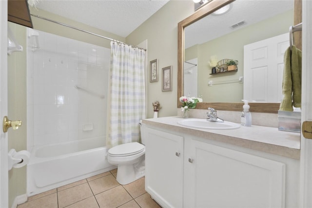 full bathroom with tile patterned flooring, shower / bath combination with curtain, a textured ceiling, toilet, and vanity