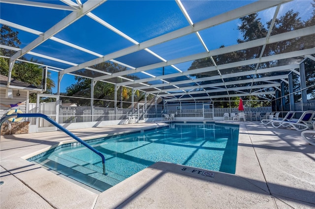 view of pool with a lanai and a patio