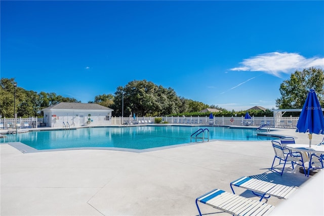 view of pool featuring a patio