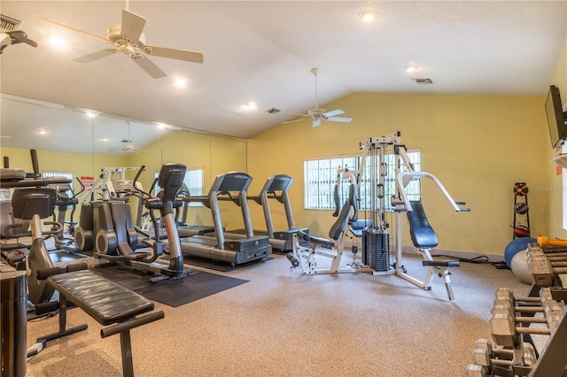 gym with vaulted ceiling, ceiling fan, visible vents, and baseboards