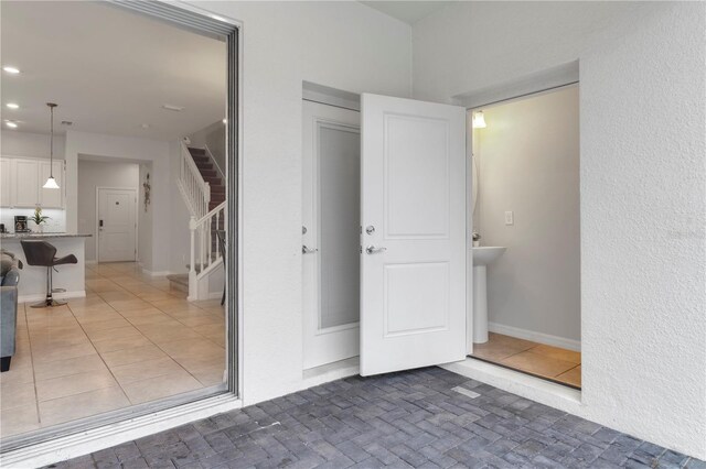 7424 Oakmoss Loop, Davenport, FL 33837 - interior space with recessed lighting and light tile patterned flooring