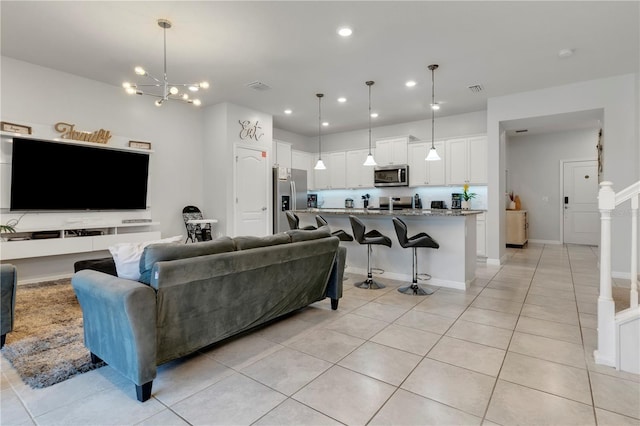 7424 Oakmoss Loop, Davenport, FL 33837 - living area with light tile patterned flooring and recessed lighting