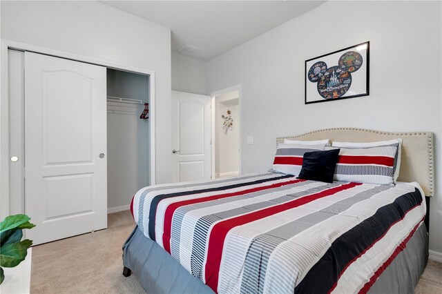 carpeted bedroom featuring a closet