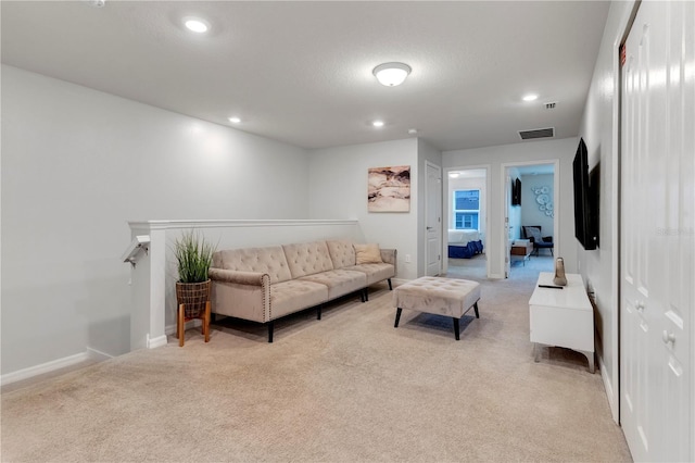 7424 Oakmoss Loop, Davenport, FL 33837 - living room featuring light colored carpet and recessed lighting