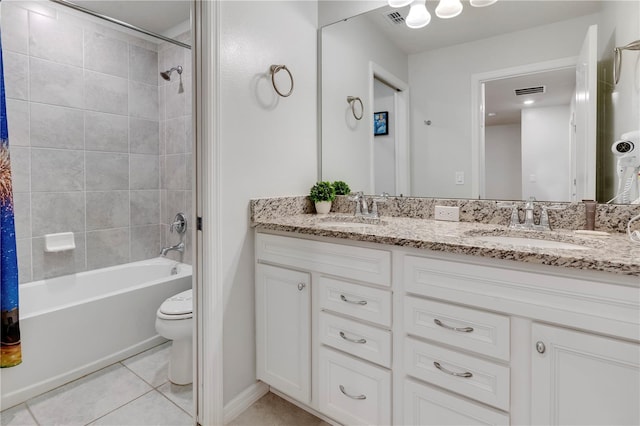 full bathroom with tile patterned floors, vanity, toilet, and shower / tub combo