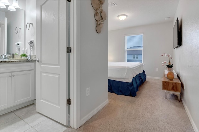 bedroom featuring light carpet