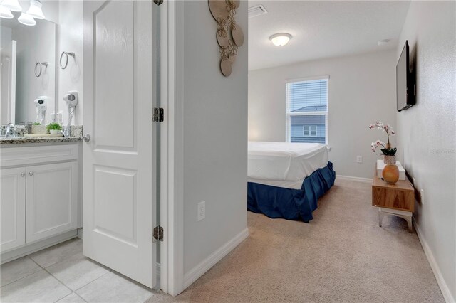 7424 Oakmoss Loop, Davenport, FL 33837 - bedroom featuring baseboards and light carpet