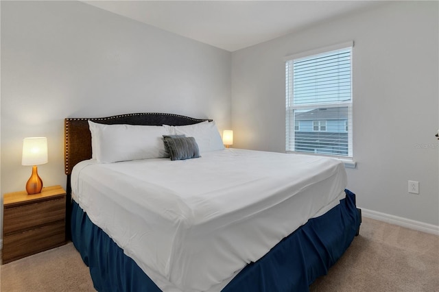 bedroom featuring light colored carpet