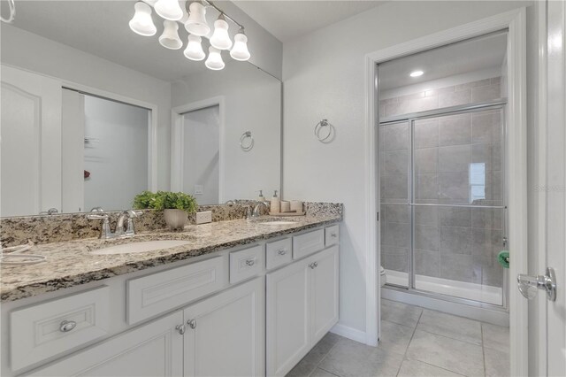 7424 Oakmoss Loop, Davenport, FL 33837 - full bath with double vanity, a shower stall, and tile patterned floors