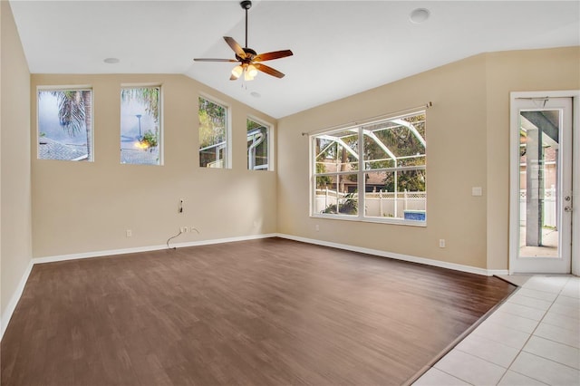 unfurnished living room featuring ceiling fan, light hardwood / wood-style floors, and vaulted ceiling