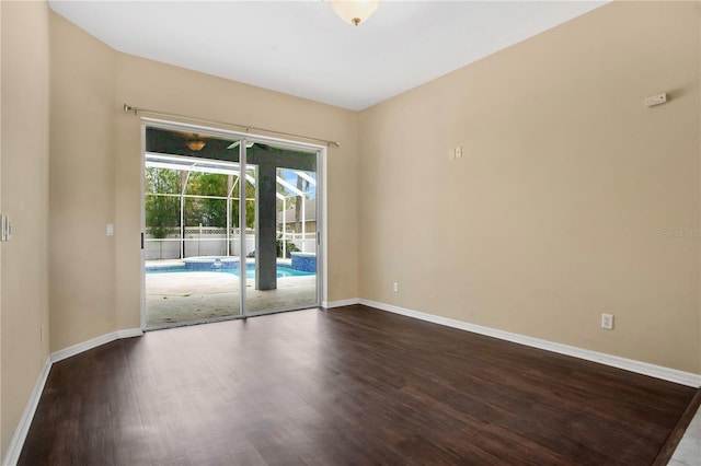 unfurnished room with wood-type flooring