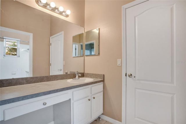 bathroom featuring tile patterned floors and vanity