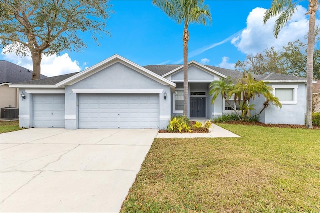 ranch-style home featuring central air condition unit, a front lawn, and a garage