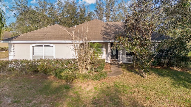 view of front of home featuring a porch and a front lawn