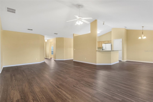 unfurnished living room with dark hardwood / wood-style floors, ceiling fan with notable chandelier, and vaulted ceiling