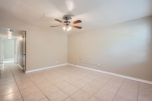 tiled empty room with ceiling fan