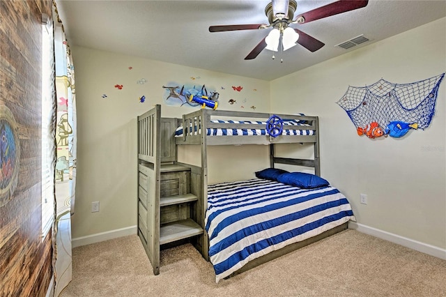 1636 Moon Valley Dr, Davenport, FL 33896 - carpeted bedroom featuring baseboards and a ceiling fan