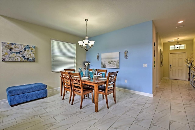 1636 Moon Valley Dr, Davenport, FL 33896 - dining space featuring light marble finish flooring, a chandelier, and recessed lighting