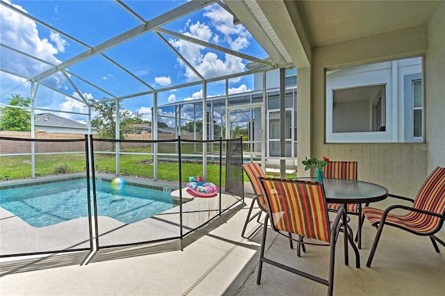 view of swimming pool with a lanai and a patio