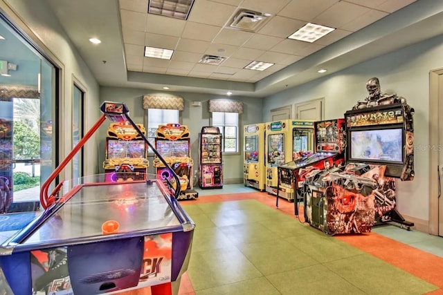 game room featuring a drop ceiling