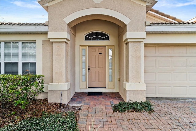 doorway to property featuring a garage