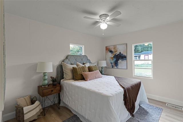 bedroom featuring ceiling fan and light hardwood / wood-style flooring