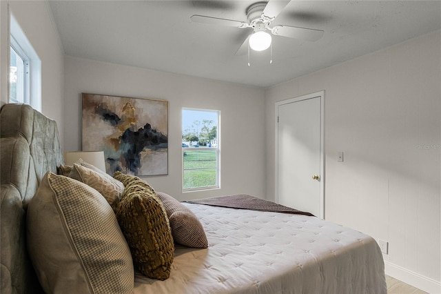 bedroom featuring ceiling fan and light hardwood / wood-style floors