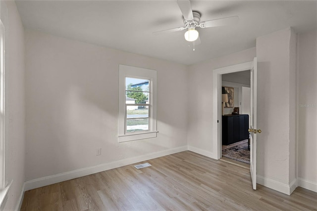 spare room featuring ceiling fan and light hardwood / wood-style floors