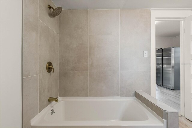 bathroom featuring shower / bathing tub combination and wood-type flooring