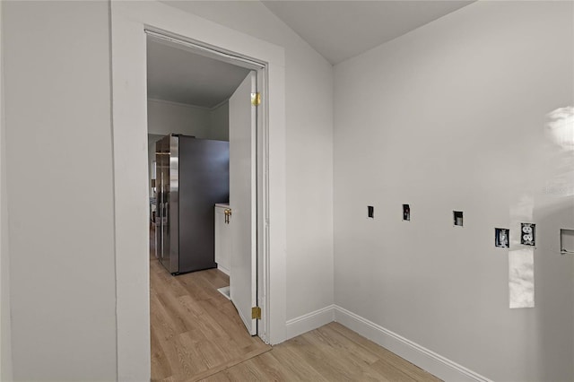 laundry room with light hardwood / wood-style floors