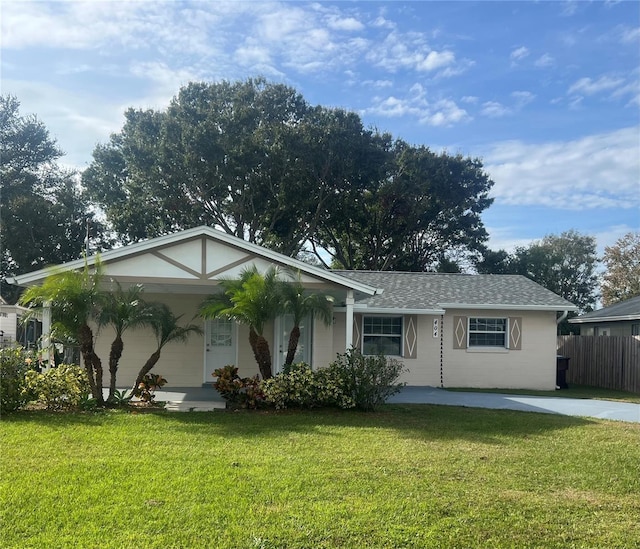 single story home with a front lawn and a garage