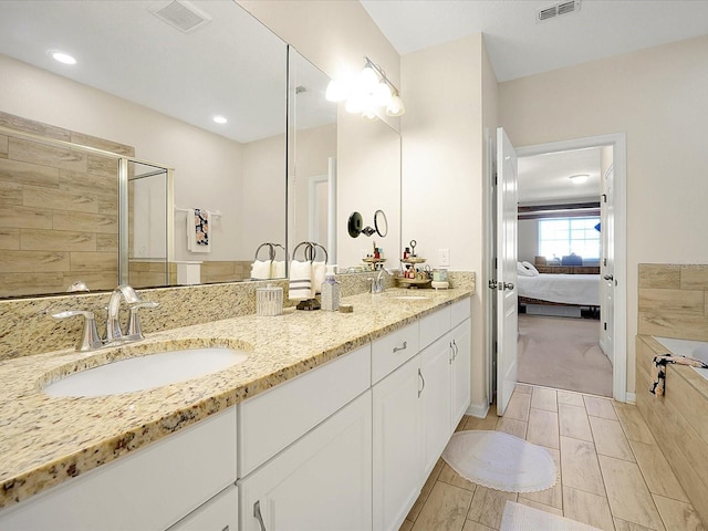 bathroom featuring vanity and walk in shower