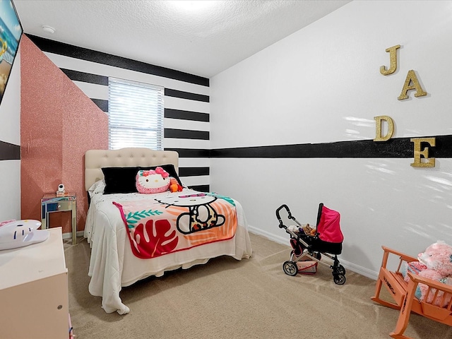 bedroom with carpet flooring and a textured ceiling