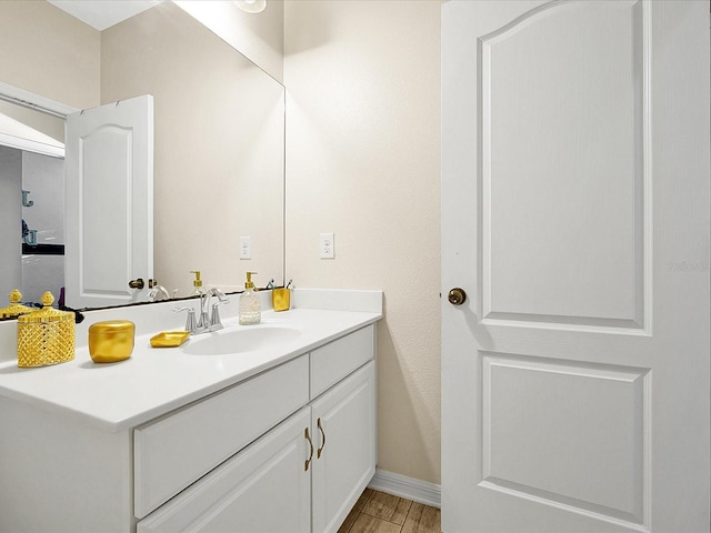 bathroom with wood-type flooring and vanity