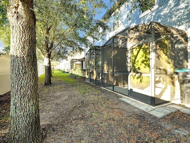 view of yard with a lanai