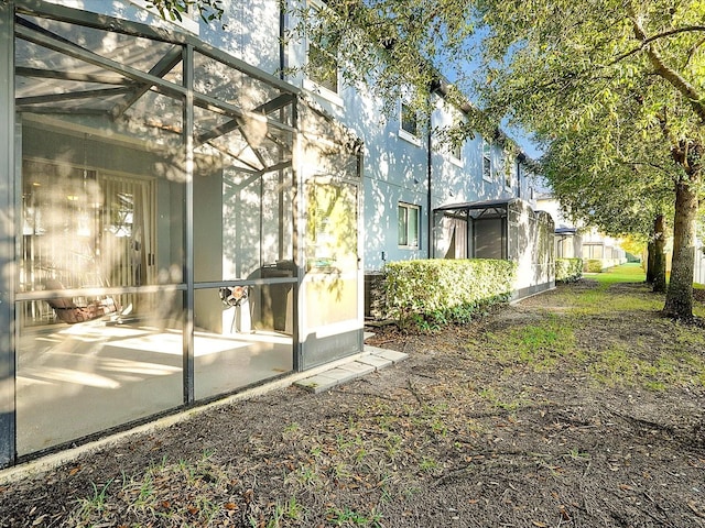 exterior space with a lanai and a patio area