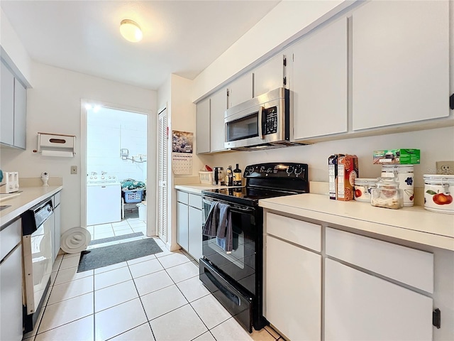 kitchen with white cabinetry, electric range, dishwasher, and light tile patterned floors