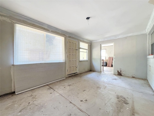 spare room featuring ornamental molding