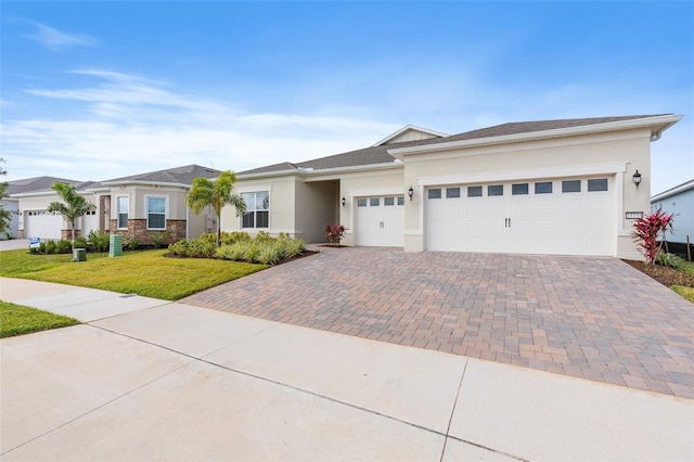 view of front of house with a garage and a front lawn