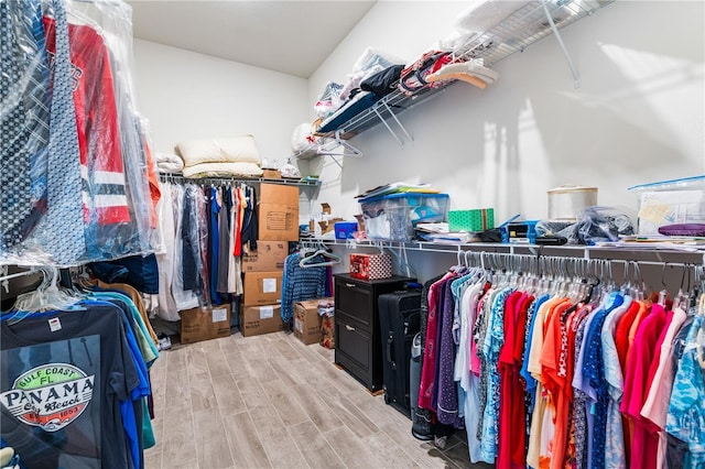 walk in closet featuring light hardwood / wood-style flooring