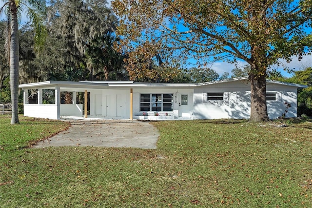 rear view of house with a lawn