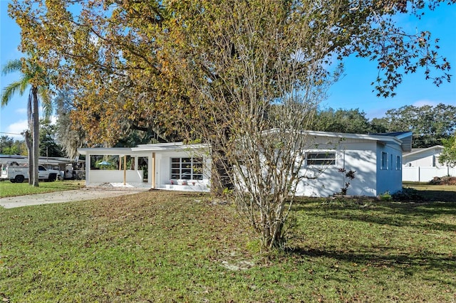 ranch-style house with a front yard