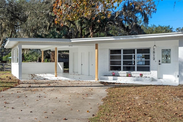 exterior space with a carport