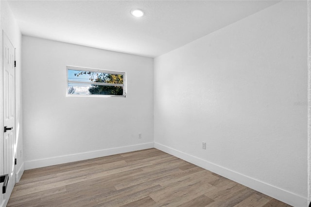 unfurnished room featuring light hardwood / wood-style floors