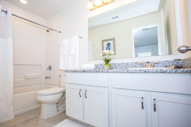 full bathroom featuring shower / bath combo, toilet, and vanity