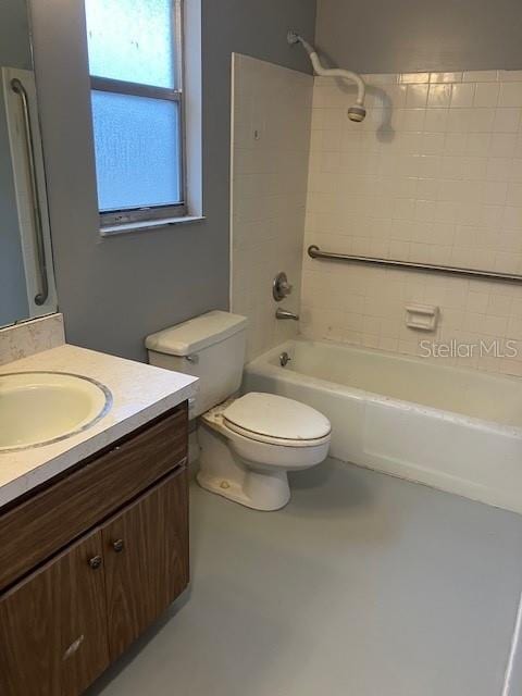 full bathroom featuring vanity, toilet, and tiled shower / bath combo